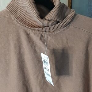 A brown turtleneck Brown poncho large